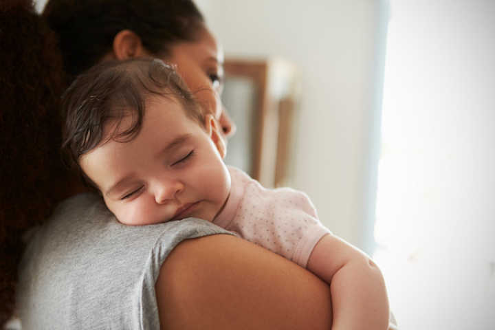 Mom with sleeping child